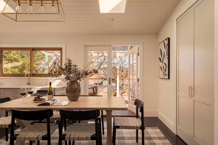 Bright kitchen and dining area at Berridge Ville, with French doors opening to the garden.
